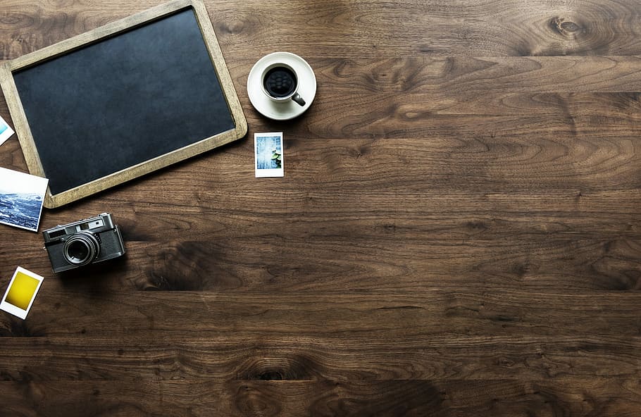 Oval Table Top View, name, coffee, camera  photographic equipment, tags