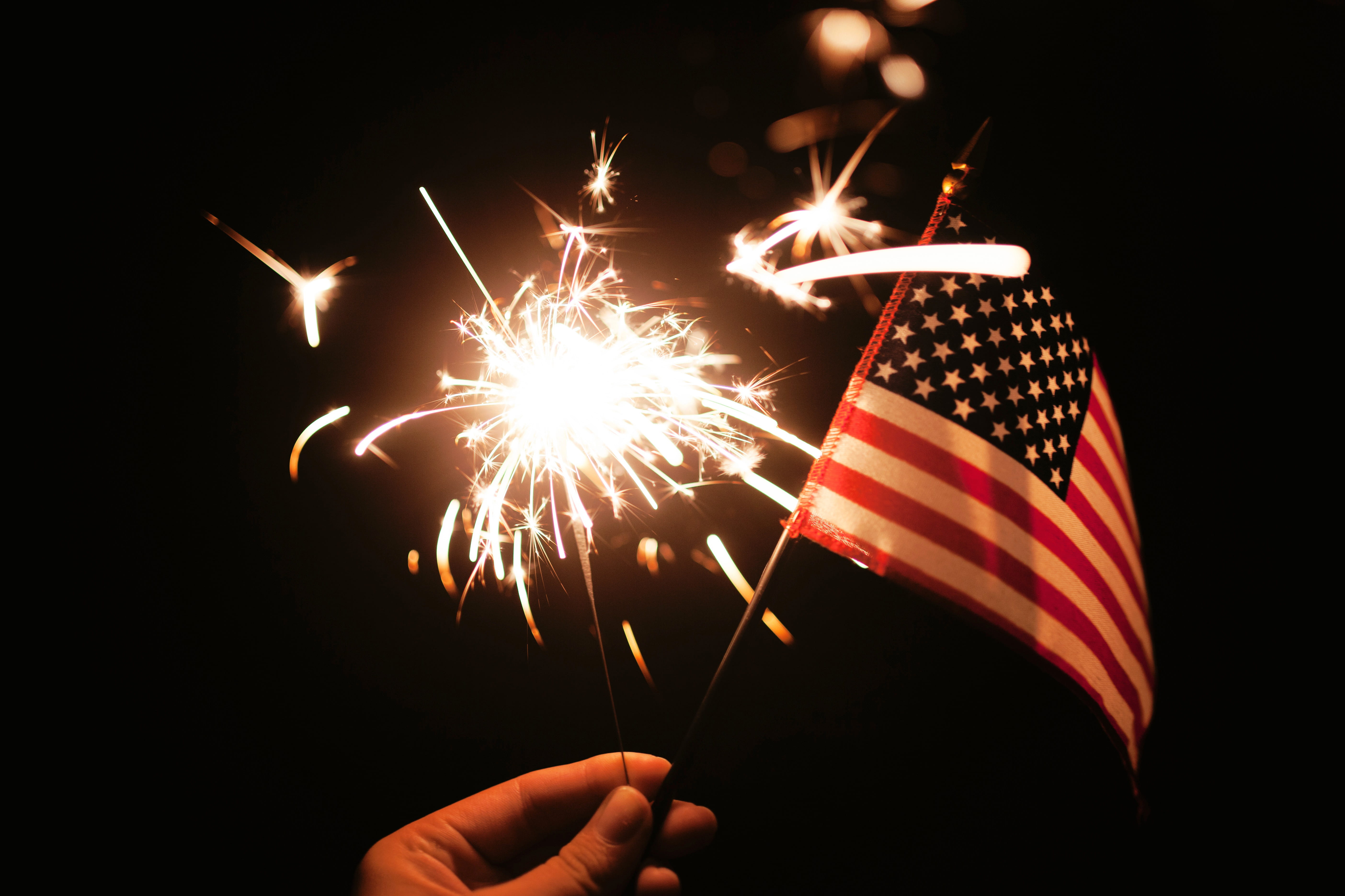 flag, hand, firework man made object, holding