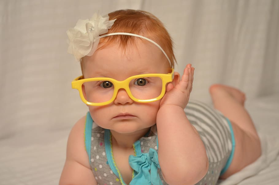 Baby Girl with Glasses, smile, portrait, front view, human face