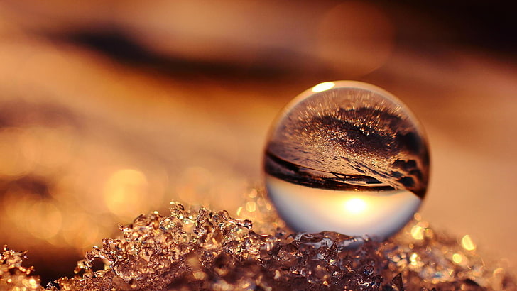 Granite Sphere, shiny, fire, gold, selective focus