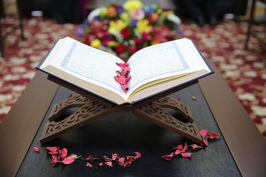 Saudi Quran, book, floral pattern, table, red Free HD Wallpaper