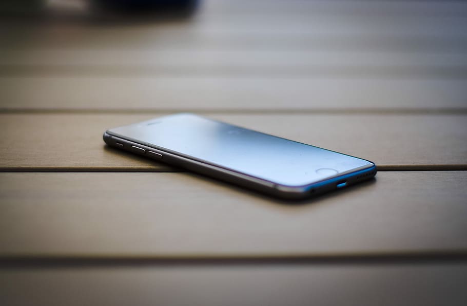 Phone Laying On Table, blue, mobile, selective focus, closeup Free HD Wallpaper
