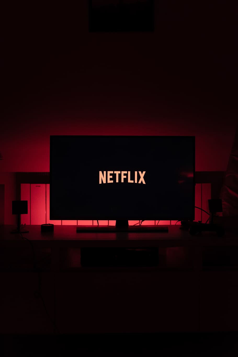 Netflix in TV, neon, architecture, decor, western script Free HD Wallpaper