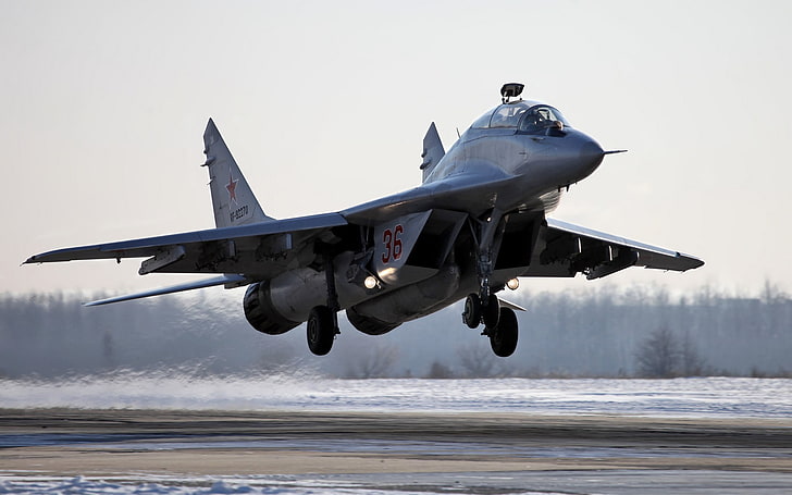 Mikoyan MiG-21, on the move, two people, flying, side view Free HD Wallpaper