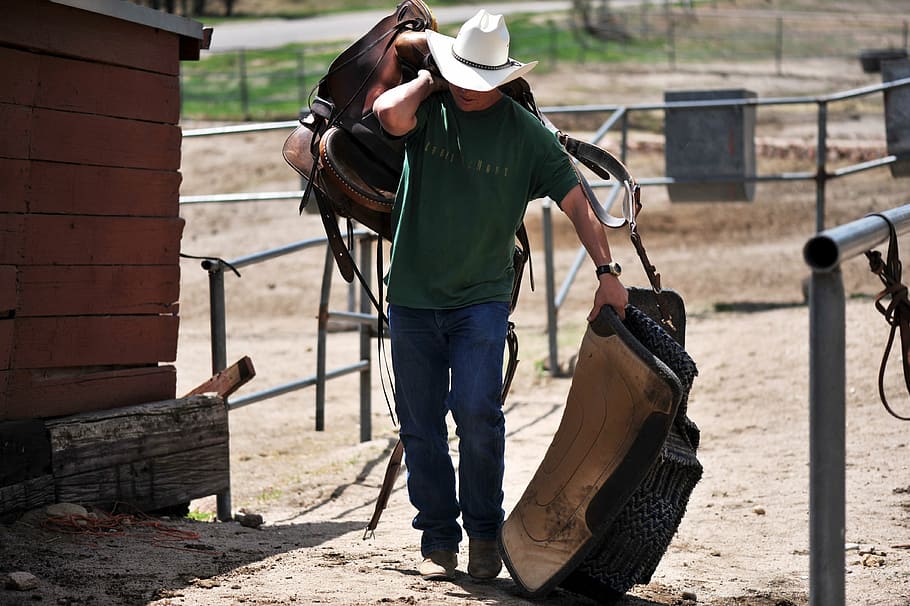 Cowboy Horse Saddle, full length, barn, real people, blanket Free HD Wallpaper