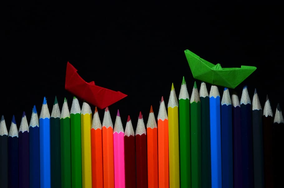 Crayons vs Colored Pencils, graph, large group of objects, creativity, black background