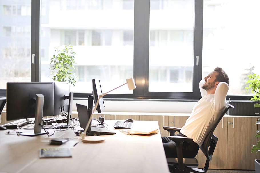 Person Leaning Back in Chair, working, male, desk, white shirt Free HD Wallpaper