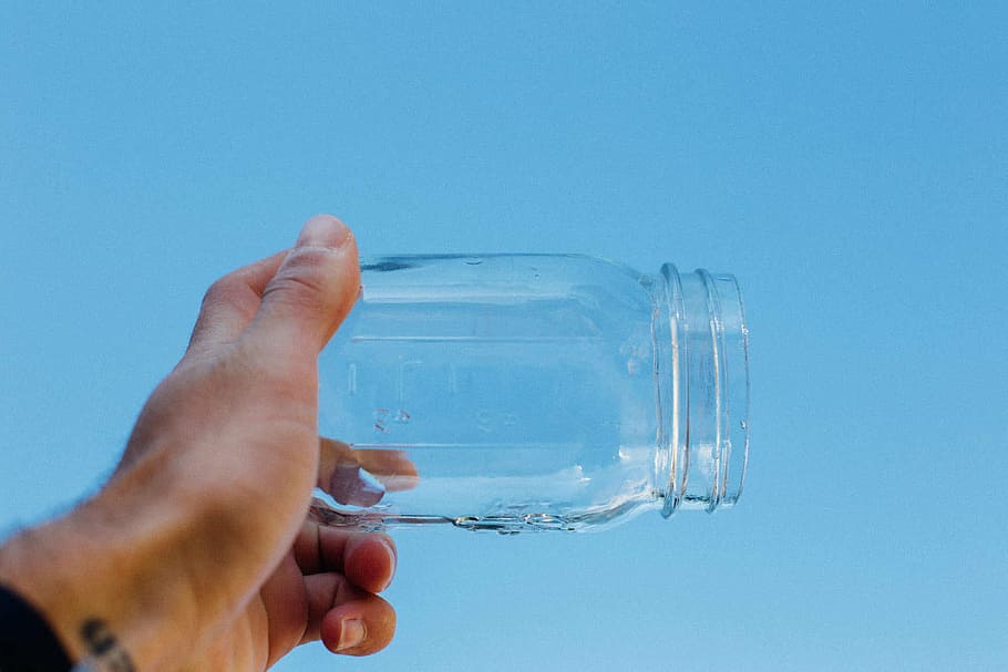 water, indoors, blue background, hands