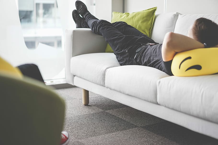 Man Relaxing On Sofa, white, real people, indoors, thinking