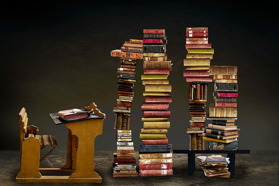 Literature Genres, graduation, black background, book stack, arrangement